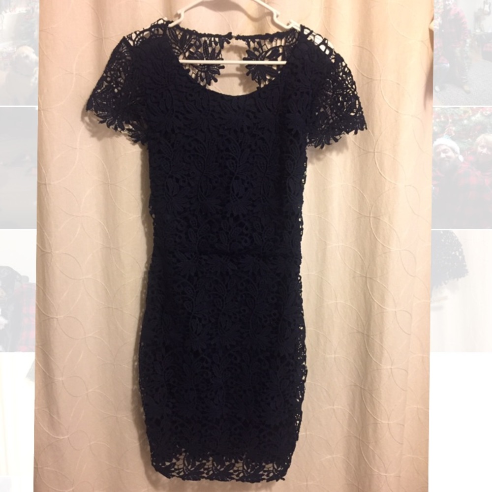 Navy lace cocktail dress with open back.